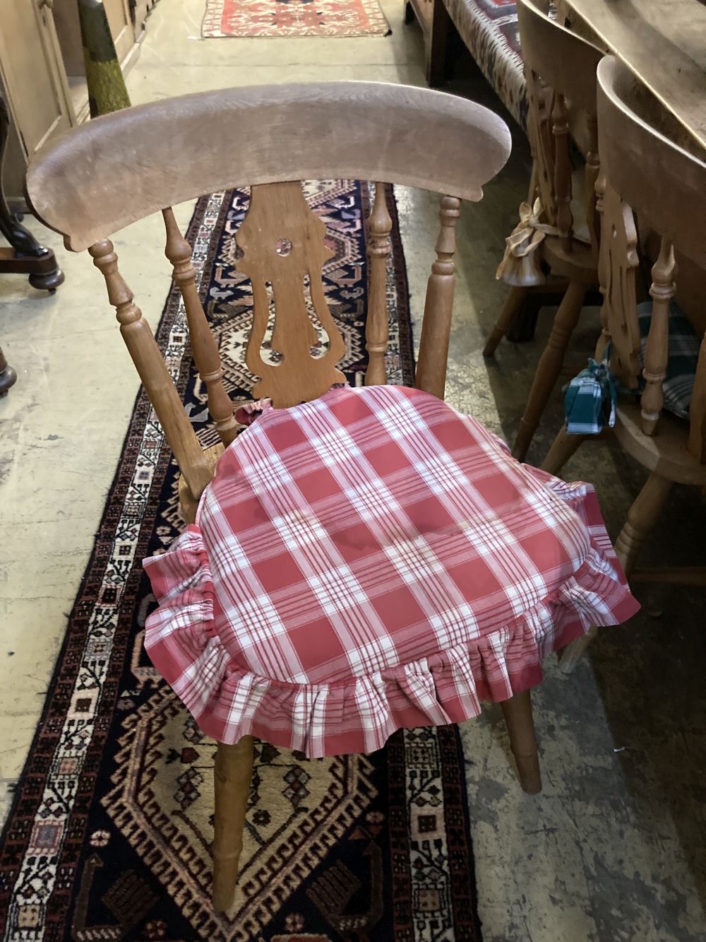 Two Victorian elm and beech smokers bow elbow chairs together with six Windsor kitchen chairs